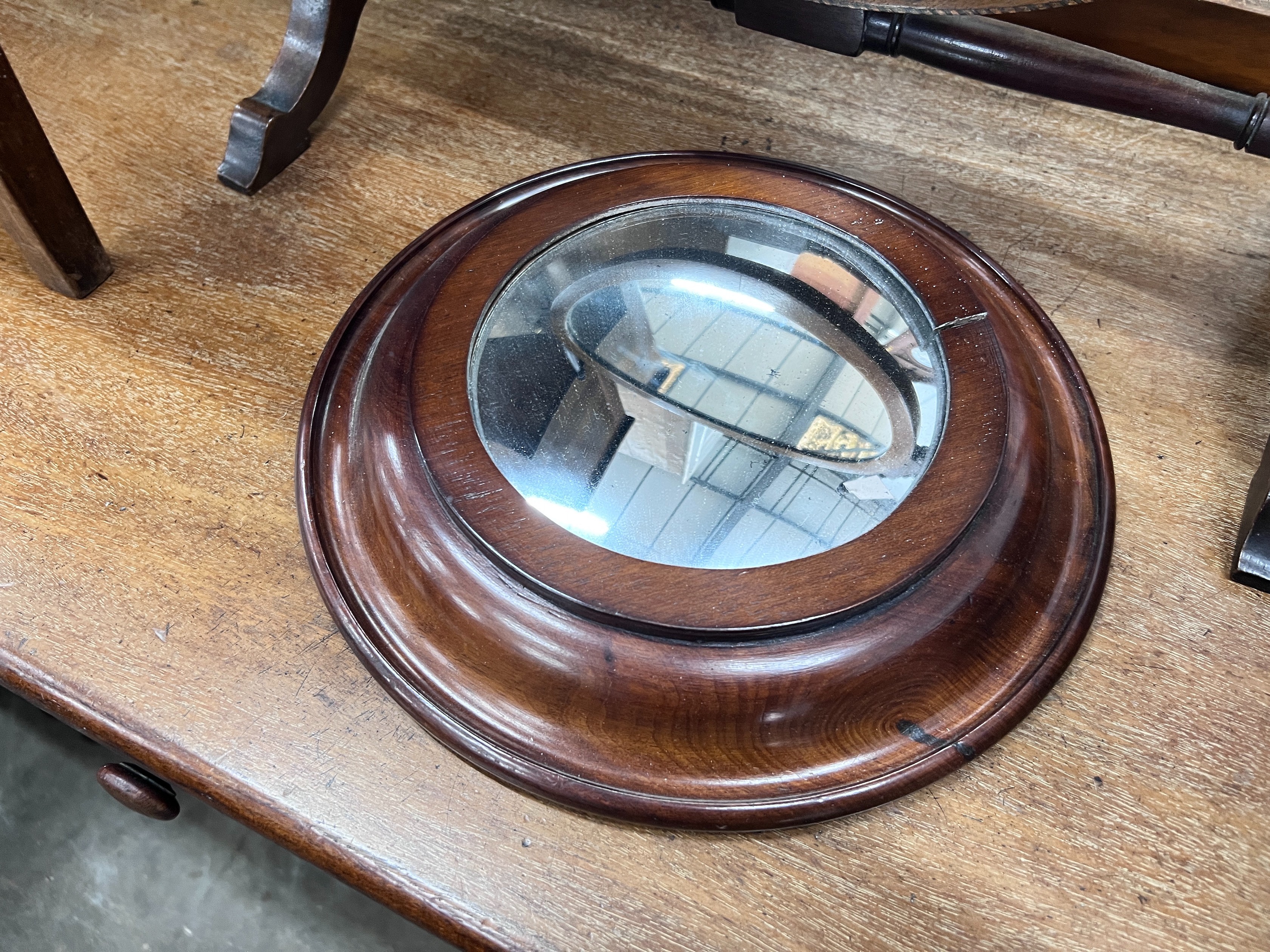 An Edwardian skeleton toilet mirror, 44cm, and a convex wall mirror, 26cm *Please note the sale commences at 9am.